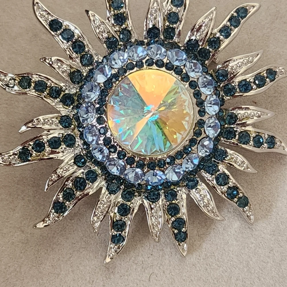 Silver and Blue Starburst Sun Brooch Pin